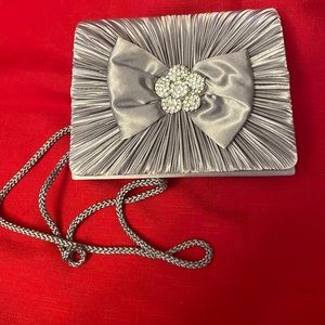 Elegant Silver Evening Bag embellished with a Gathered Front, Bow & Rhinestones